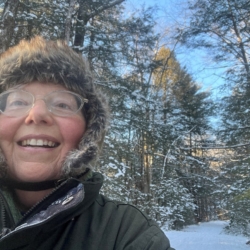 Photo of women with a snowy background.